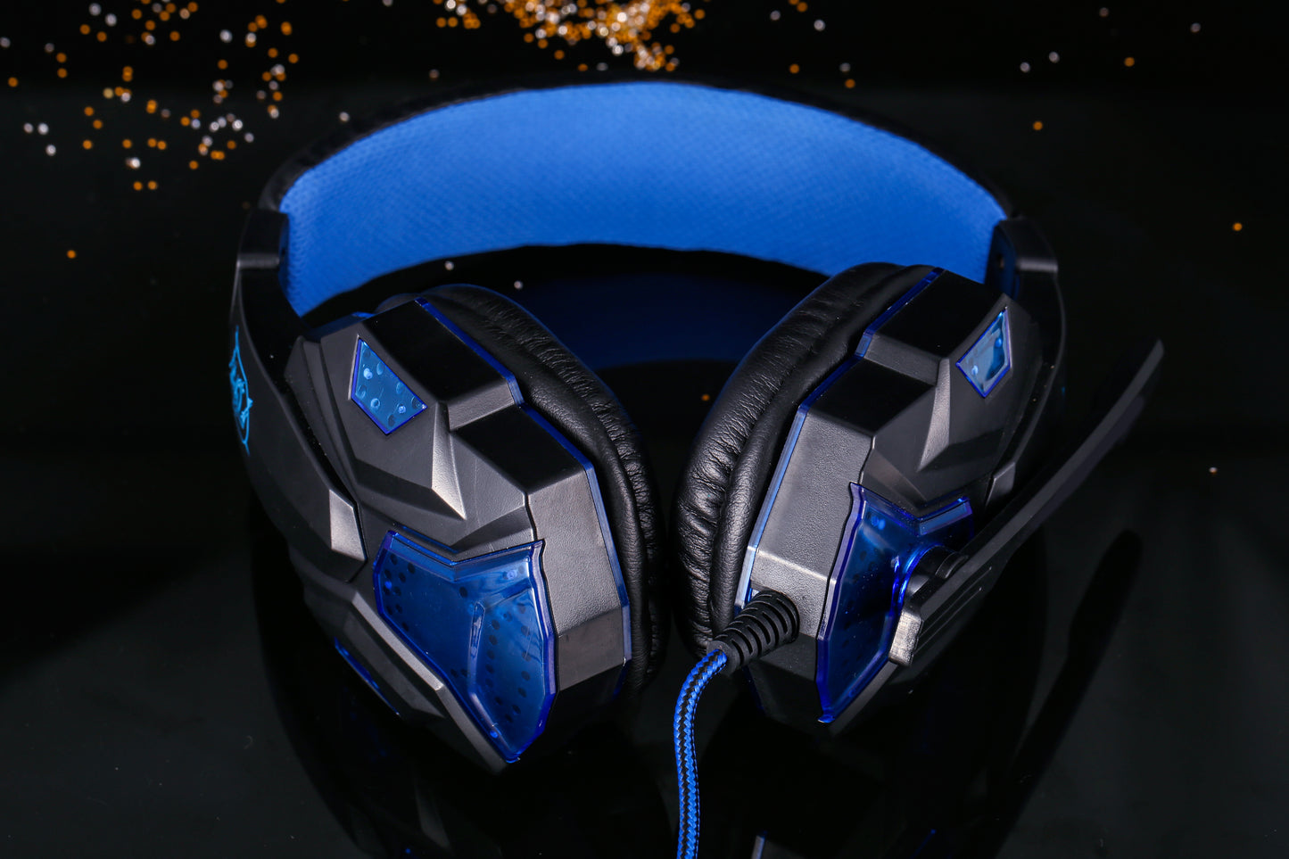 Wired over-ear gaming headphones feature RGB lighting, a built-in microphone, and a Type-C USB connection